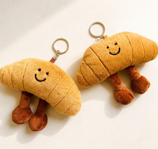 🥐soft keychain in the shape of a large croissant…
